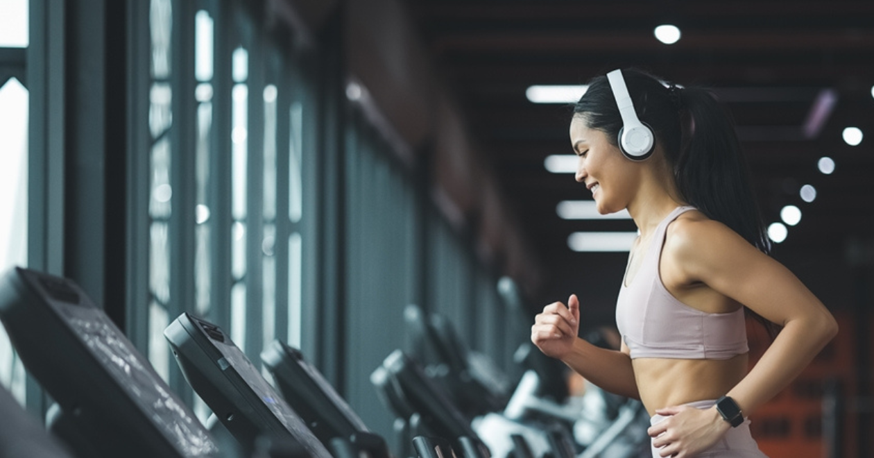 Runner with large headphones