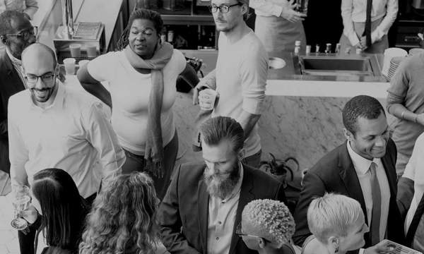 A large group of people networking at an event