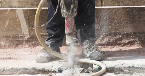 Man operating a jackhammer