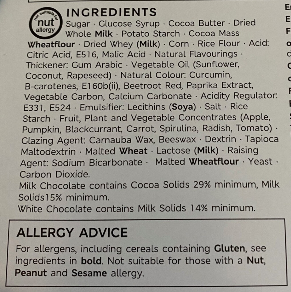 Food packaging allergen label showing full ingredient list with allergens highlighted in bold, including wheat, milk, and soya. Includes an allergy advice box noting nut, peanut, and sesame risks.