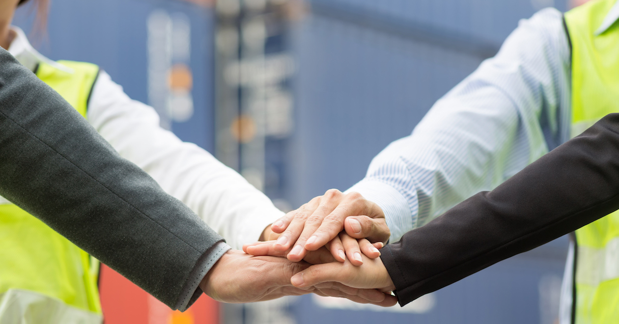 Business team join hands