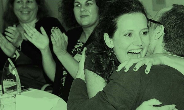 Couple sharing ecstatic hug