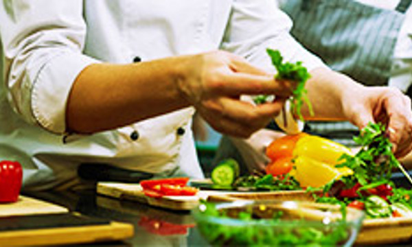 Person preparing vegetables in a kitchen