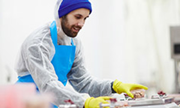 A person preparing food in a test kitchen
