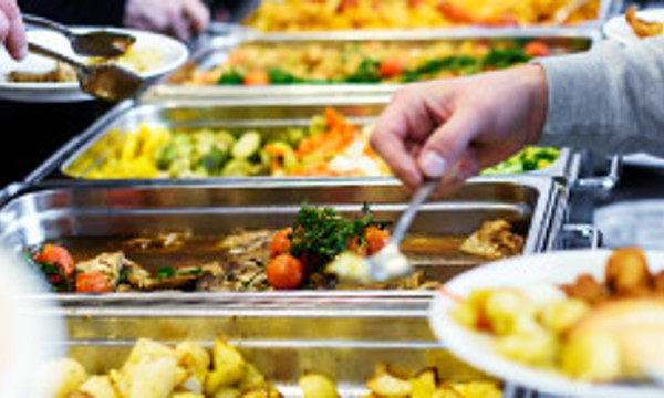 People choosing food at a buffet