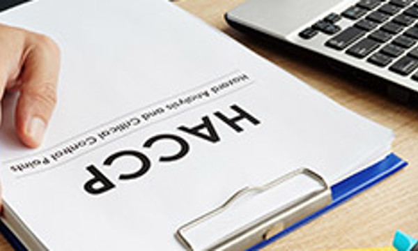 A clipboard and paper that says HACCP