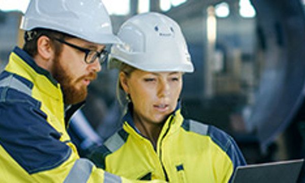Two people in high-vis jackets
