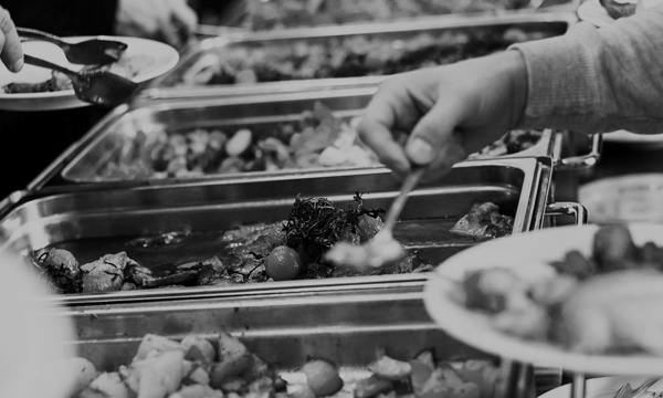 People choosing food at a buffet