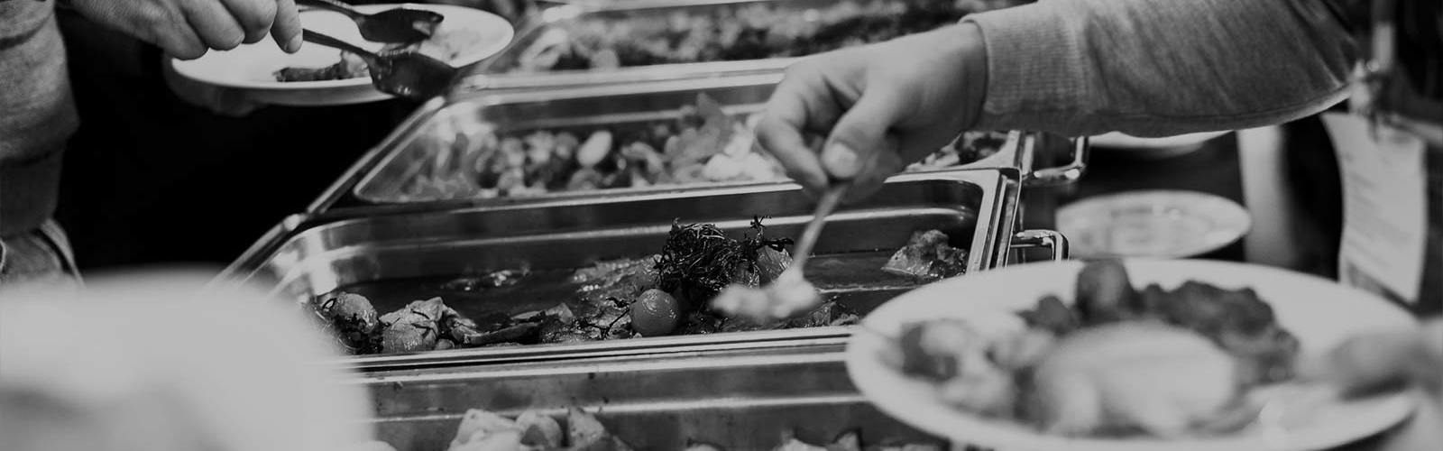 People choosing food at a buffet