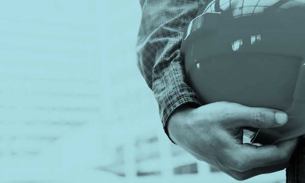 Hand holding a hard hat