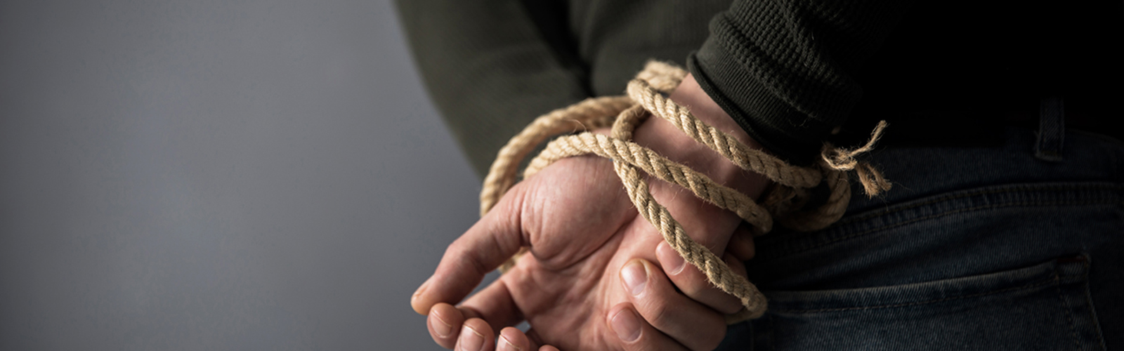Hands tied with rope