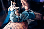 A tattooist at work