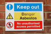 Keep out sign saying 'danger asbestos' and 'no unauthorised access permitted'