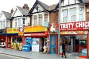 Row of takeaways and shops