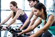 People on exercise bikes: research has found benefits of labelling food with how long it would take to burn off calories consumed