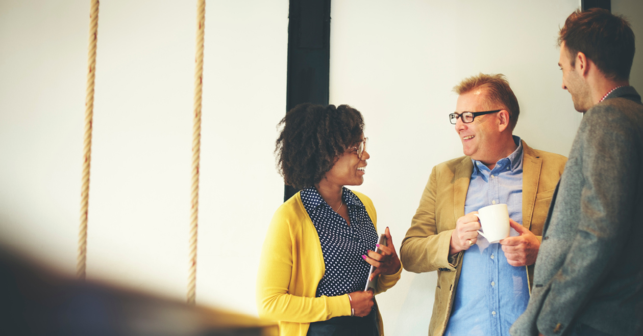 Employees networking over coffee