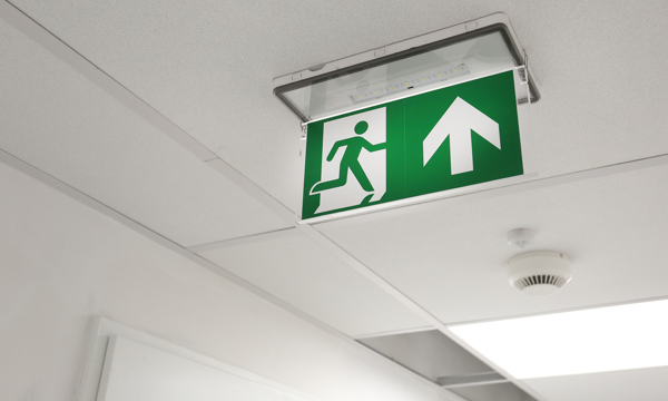 An emergency exit sign on a ceiling 