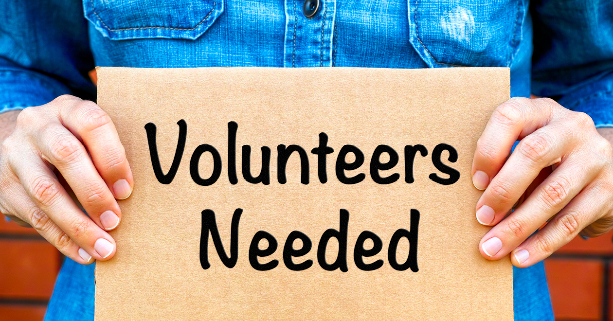 Sign that says 'Volunteers Needed'