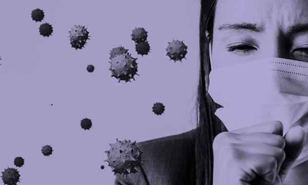 A person coughing whilst wearing a face covering with covid molecules in the air beside them. 