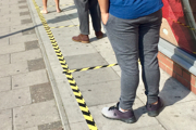 People in a queue with distance markers