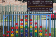 Up Holland, West Lancashire, UK: wooden rainbow blocks on a school gate in support of the NHS