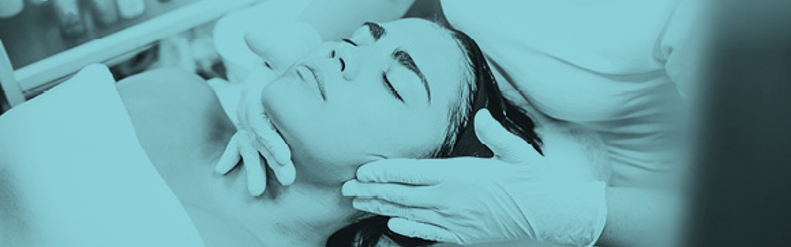 A person receiving a cosmetic treatment to the face