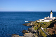 Douglas Lighthouse on the Isle of Man with sea on sunny day