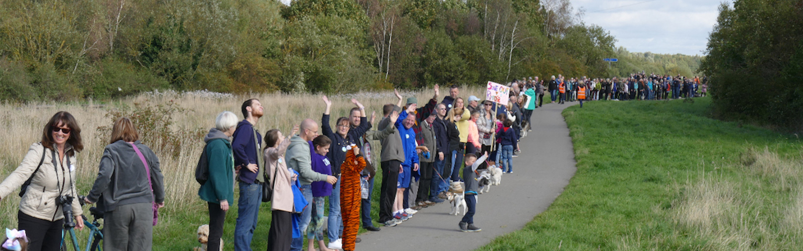 Environmental activists at Rimrose Valley in Liverpool (A5036) make a long line down a path