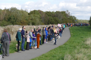 Environmental activists at Rimrose Valley in Liverpool (A5036) make a long line down a path