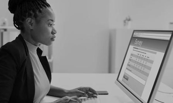 A person looking at a computer screen