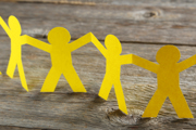 A yellow paperchain on a wooden background