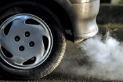 Close-up of a car exhaust and wheel