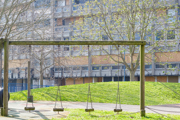 A playground, with block of flats in background
