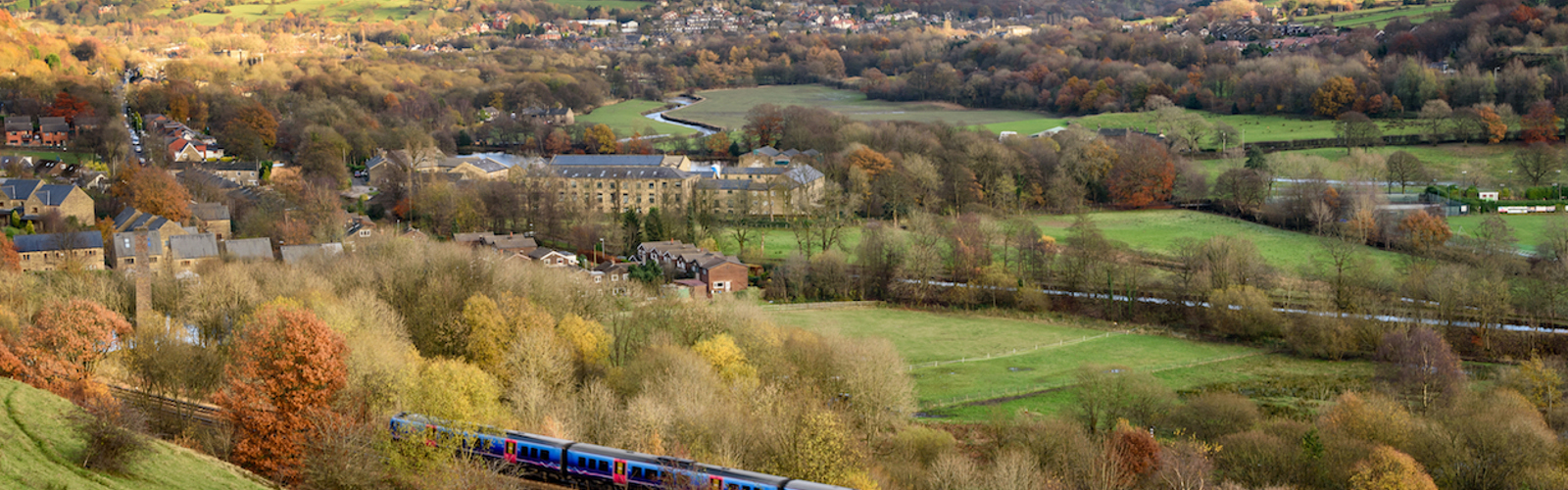 A train passes through British countryside