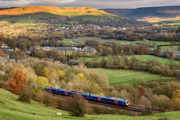 A train passes through British countryside