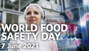 Food safety inspector with animated virus and text 'World Food Safety Day 7 June 2021'