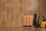 A forklift truck against a wooden background