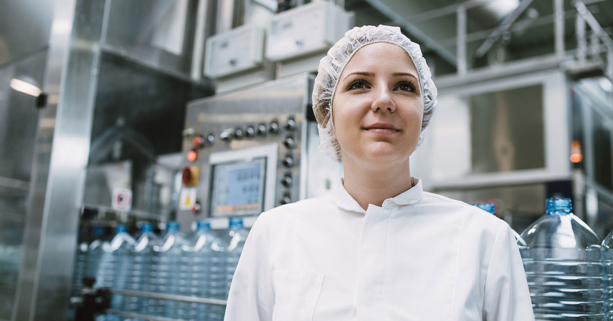 Woman environmental health professional wearing a lab coat