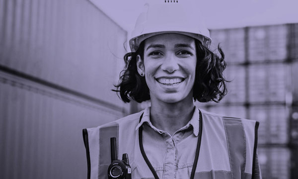 A person wearing a hard hard and safety vest