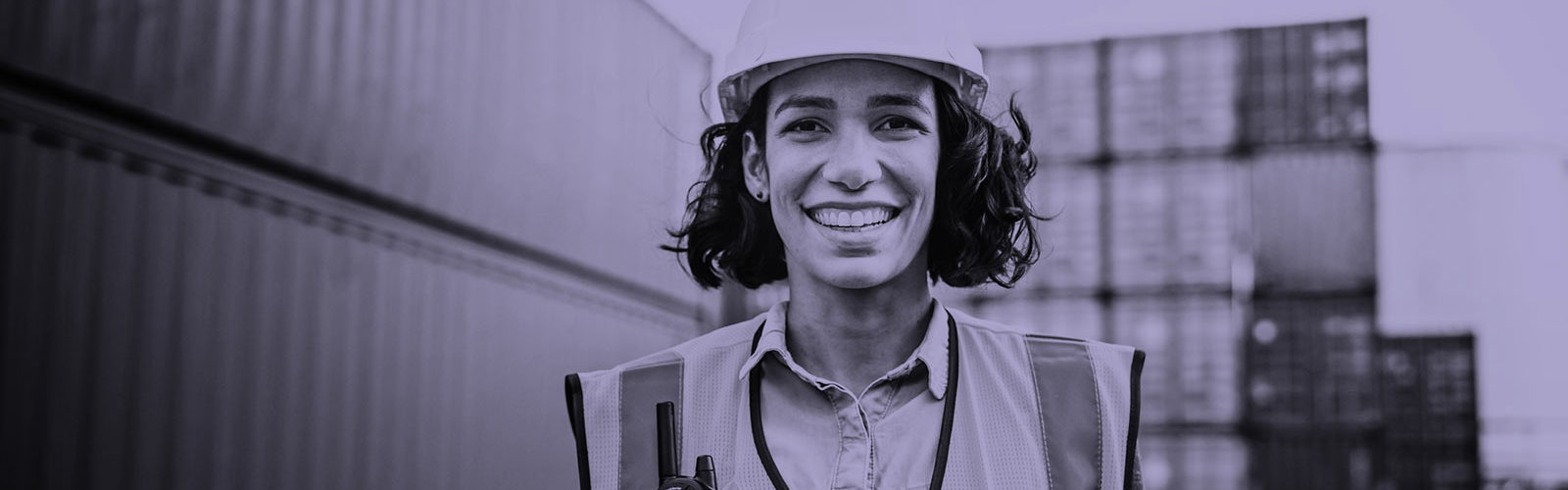Woman wearing a hard hard and safety vest