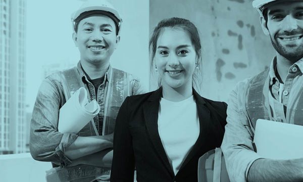 Three people at a construction site