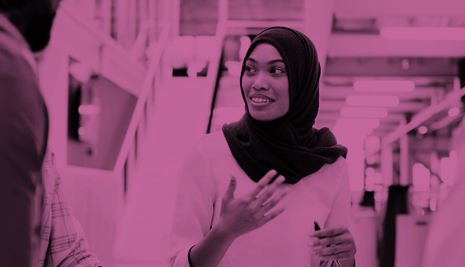 Woman chatting to colleagues