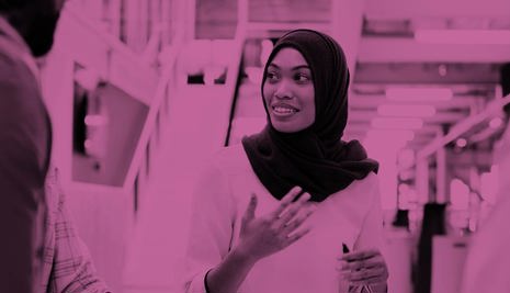 Woman chatting to colleagues