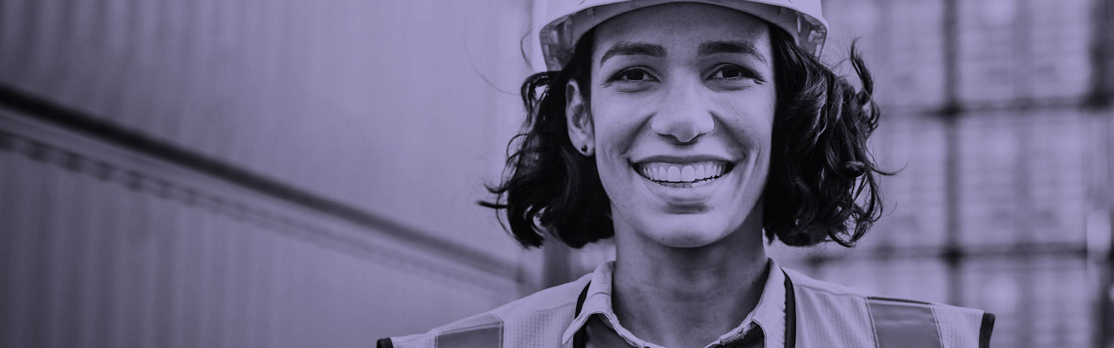 Woman wearing a hard hard and safety vest
