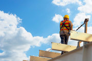 Construction working on rooftop