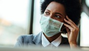 Businesswoman wearing a face mask while in the office