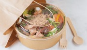 Take away salad in brown bowl and bag