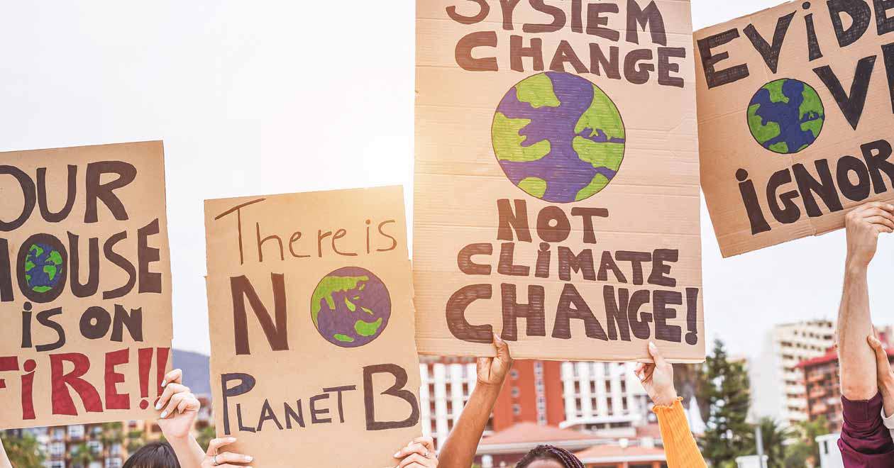 Group of demonstrators with banners fighting for climate change