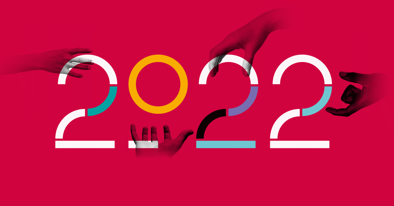 Hands holding the number 2022
