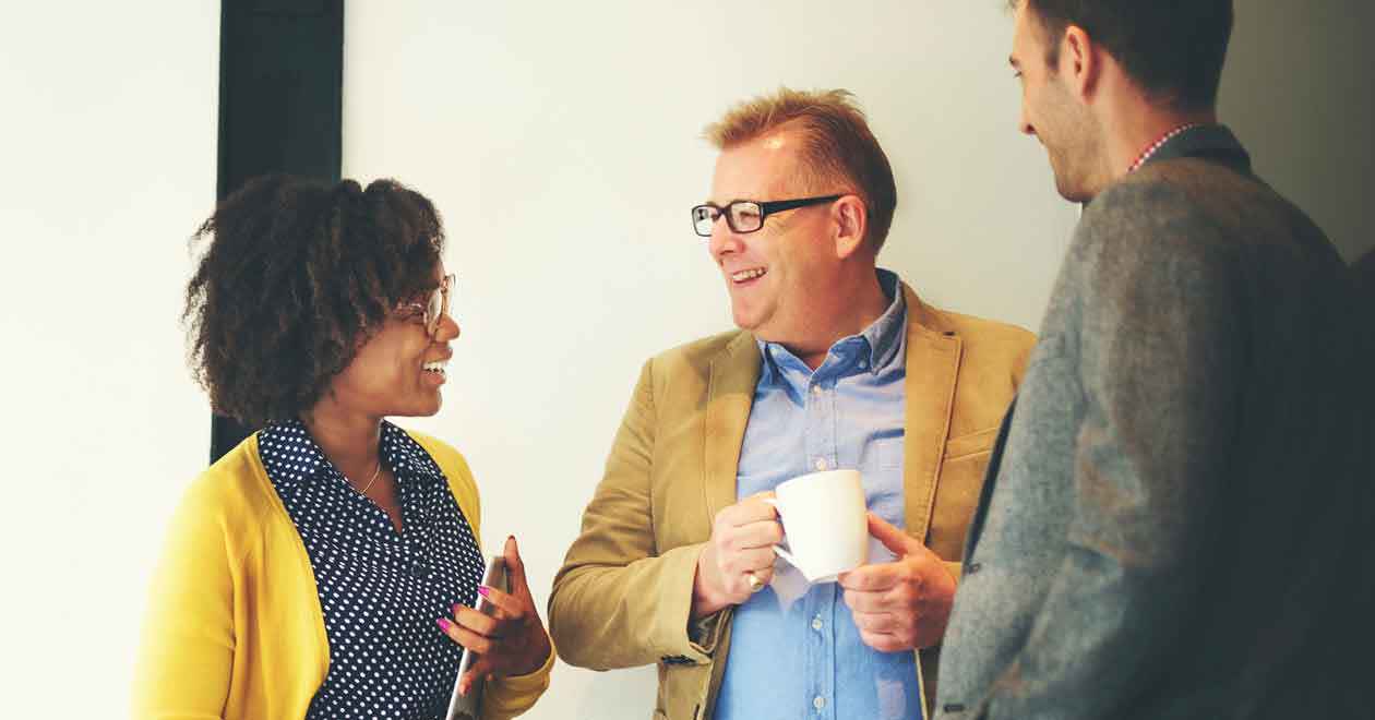 Three people chatting